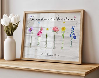 May include: A white wood sign with the text "Grandma's Garden" in black cursive lettering.  The sign features a watercolour illustration of six different flowers with the names of each flower written below.  The text "Love Grows Here" is written in black cursive lettering at the bottom of the sign.