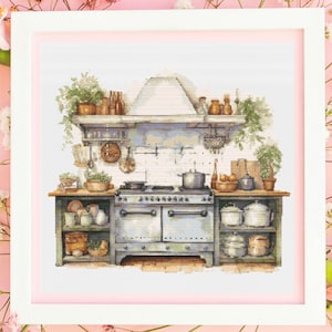 May include: Cross-stitch depicting a vintage kitchen. The image shows a light blue stove, shelves filled with pots, plants, and kitchen utensils. The artwork is framed in white, set against a pink floral background, creating a cosy, rustic aesthetic.