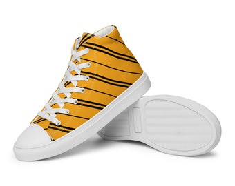 May include: High-top canvas sneakers with a yellow and black striped pattern. The shoes have white laces and a white sole.