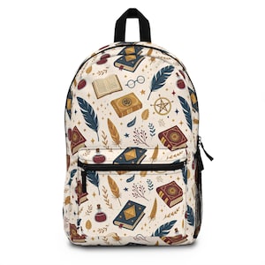 May include: Cream-colored backpack with a repeating pattern of books, feathers, potion bottles, and celestial symbols. The backpack has a black top handle, black zippers, and a front pocket. The design includes shades of blue, brown, and red.