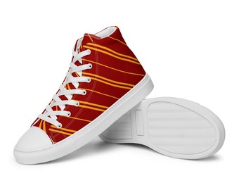May include: Red and yellow high-top sneakers with a striped pattern. The shoes have white laces and a white sole.