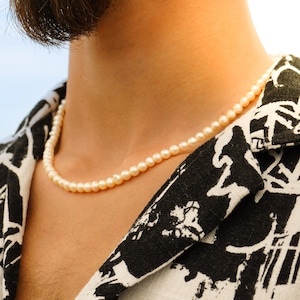 Elegant freshwater pearl chain, adjustable between 45-50cm, beautifully handcrafted to adorn summer beach outfits with grace.