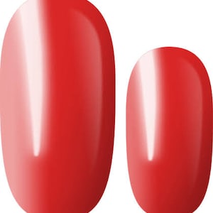 May include: Two red oval-shaped nail polish tips.