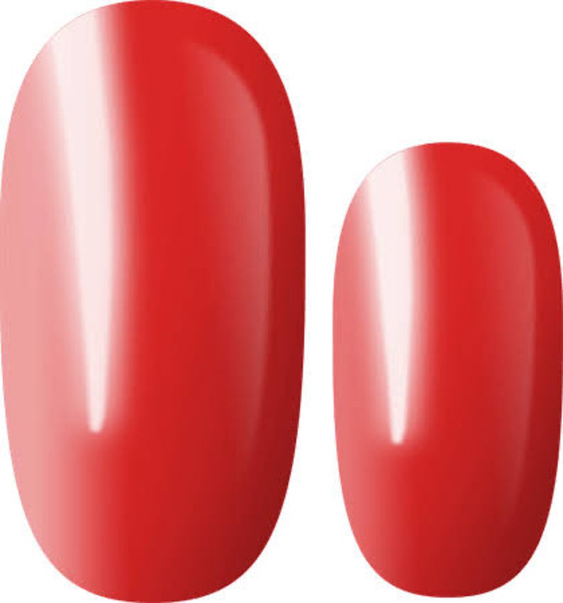 May include: Two red oval-shaped nail polish tips.