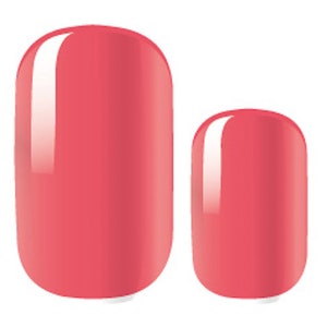 May include: Two oval-shaped press-on nails in a light coral color. The nails have a glossy finish.