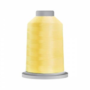 May include: A spool of pale yellow thread on a gray plastic bobbin.