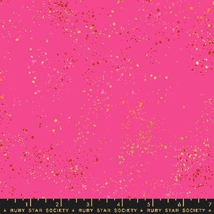 May include: Pink fabric with a scattered gold and orange confetti pattern.  The fabric has a subtle texture and a soft, slightly shiny finish.