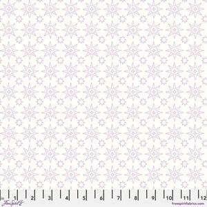 May include: White fabric with a repeating pattern of lavender star shapes. The stars vary in size and are outlined. The fabric has a ruler along the bottom edge, with the text "Free Spirit" and "freespiritfabrics.com".