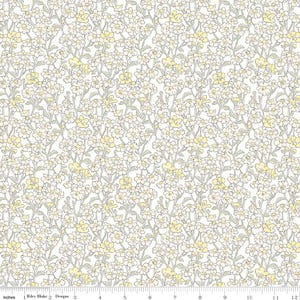May include: White fabric with a repeating pattern of small yellow and gray flowers. The fabric is designed by Riley Blake Designs.