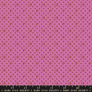 May include: A pink fabric with a repeating pattern of small red stars and crescent moons.