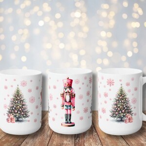 May include: Three white ceramic mugs with Christmas designs. One mug features a pink and red nutcracker, another has a pink Christmas tree with ornaments, and the third mug has a pink Christmas tree with ornaments and presents.
