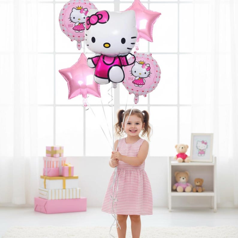 May include: A young girl holds a collection of pink Hello Kitty-themed balloons. The balloons include star and circular shapes, with the iconic character featured prominently. The girl wears a pink and white striped dress.