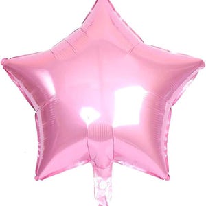 May include: A pink star-shaped balloon. The balloon is inflated and has a shiny, metallic finish. The star has five points and a small, clear plastic valve at the bottom for inflation.