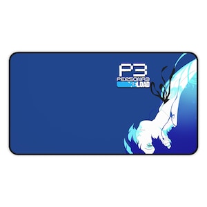 May include: A blue and black gaming mouse mat featuring a stylised image of a character from the video game Persona 3. The text "P3 PERSONA3 LOAD" is displayed on the mouse mat.