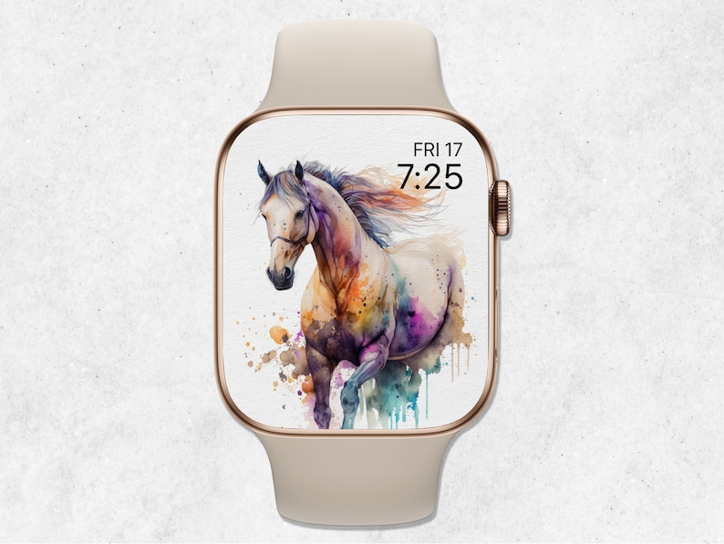 May include: A watercolor painting of a white horse running with splashes of color on a white background. The image is displayed on a smartwatch with a gold frame and a white band. The time is 7:25 and the date is FRI 17.