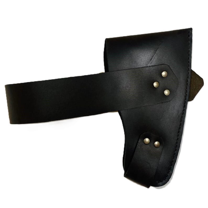 May include: Black leather axe sheath with a wide belt loop and a smaller strap secured with silver-colored rivets. The sheath is designed to hold an axe head and protect the blade.