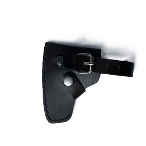 May include: Black leather axe sheath with a stitched edge, a belt loop, and a buckle closure. The sheath is designed to hold a small axe or hatchet, providing protection and secure storage.