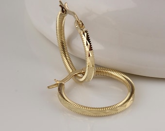 Gold earrings. Handcrafted by a 40-year-old master. Only I produce 10 carat gold earrings.