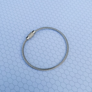 May include: A silver metal key chain with a braided cable design.