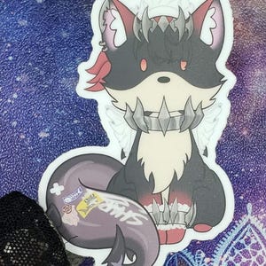 May include: A black and white cartoon sticker of a fox with red hair, wearing a spiked collar and a crown. The fox has white wings and is sitting on its haunches.
