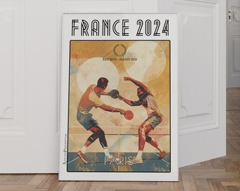 May include: A poster for the 2024 Summer Olympics in Paris, France. The poster features two athletes playing table tennis. The poster is white with black text and a red, white, and blue color scheme.