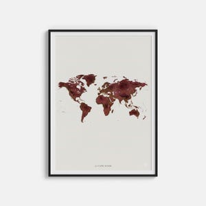 Könnte beinhalten: Gerahmter Kunstdruck einer Weltkarte. Die Karte ist in Maroon- und Goldtönen gehalten, mit Marmoreffekt. Der Druck ist vor einem cremefarbenen Hintergrund platziert und in einem schwarzen Rahmen eingefasst. Der Text "LA NAPPE MONDE" befindet sich unten.