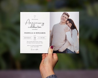 May include: A white invitation card with black text announcing an anniversary celebration for Isabella and Benjamin. The event will be held on Saturday, October 23, 2024 at 4:00 PM at The Grand Hall Event Center, 123 Main Street Anytown, USA. RSVP by September to 134-567-9087. A photo of a couple is on the right side of the card.