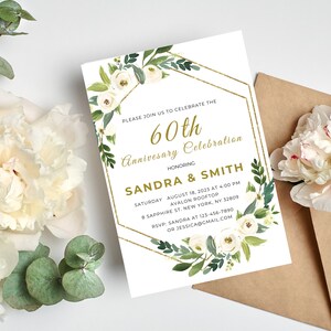 May include: A white card with gold accents and floral designs. The text on the card reads "Please join us to celebrate the 60th Anniversary Celebration honoring Sandra & Smith. Saturday August 18, 2023 at 4:00 PM Avalon Rooftop 8 Sapphire St. New York, NY 32809 RSVP: Sandra at 123-456-7890 or Jessica@gmail.com"