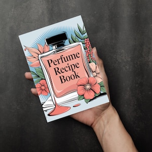 May include: An illustrated cover of a "Perfume Recipe Book" featuring a drawing of a perfume bottle and flowers in blue and pink.