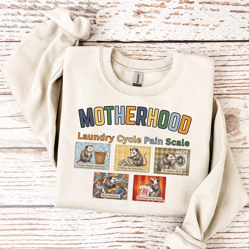 Motherhood Laundry Cycle Pain Scale Sweatshirt, Funny Mom Laundry Shirt, Tired Mom Life Shirt, Relatable Mom Humor Gift, Mother’s Day Idea Sand