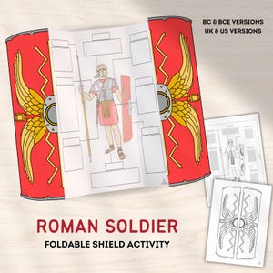 Peut inclure: Activité de bouclier pliable de soldat romain rouge, or et blanc. Le bouclier présente un motif d'ailes dorées et un schéma d'un soldat romain. Le texte "Roman Soldier Foldable Shield Activity" est affiché.