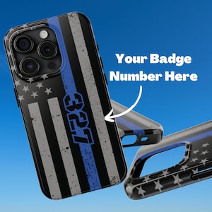 May include: A black and blue phone case with an American flag design and a thin blue line. The case has the text "3257" printed on it.