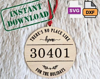 May include: A circular wooden Christmas decoration with the words "THERE'S NO PLACE LIKE home" and "30401 FOR THE HOLIDAYS". It has a red ribbon and the text "INSTANT DOWNLOAD" in a green rectangle. Includes SVG and DXF file icons.