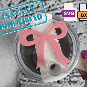 May include: A pink glitter bow is attached to a white lid of a tumbler. The words "INSTANT DOWNLOAD" are in a blue rectangle. The image also includes SVG and DXF file icons.