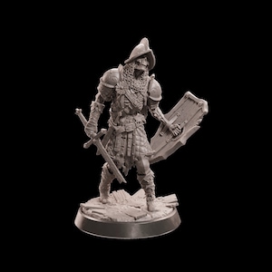 May include: A detailed figurine of a skeletal warrior, clad in armor and a helmet, holding a sword and shield. The figure stands on a textured base, with intricate details in the design. The overall color is a muted gray.