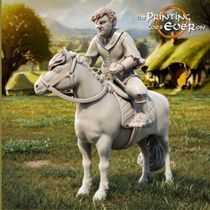 May include: A white 3D printed miniature of a hobbit riding a pony. The hobbit is wearing a tunic and breeches. The pony has a saddle and bridle. The background is a blurry image of a green field and a hobbit hole.