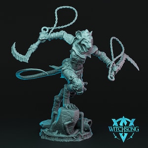 May include: A gray, detailed miniature figurine of a rat-like creature with a hooded head and a long tail. The creature is holding two curved weapons, each attached to a chain. The figurine is standing on a gray, textured base.