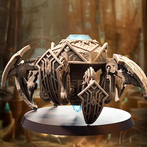 May include: A detailed, beige-colored, mechanical sculpture with intricate designs. The sculpture features shield-like elements, gears, and a central, glowing blue crystal. It is mounted on a circular, white base.