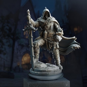 May include: A detailed gray figurine of a warrior in medieval armor, holding a large sword. The figure is posed on a stone base, with a hooded cloak and various pouches and accessories. The background is a blurred image of a castle.