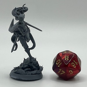 May include: A gray 3D printed miniature of a female figure with long flowing hair, holding a sword and standing on a rocky base. The figure is posed in a dynamic action pose. A red 20-sided die is in the background.