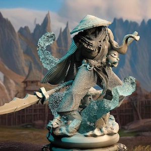 May include: A detailed figurine of a warrior in a hooded robe, holding a sword and standing on a base with swirling blue and white effects. The warrior is wearing a conical hat and has a stern expression.