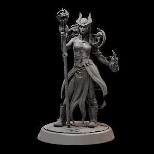 May include: A gray painted miniature figurine of a female demon with horns, holding a staff and a flaming orb. She is wearing a long, flowing robe and boots.