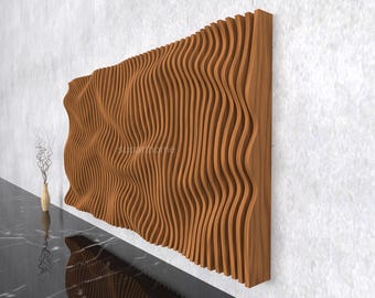 May include: A large, wooden wall panel with a wave-like design. The panel is made of vertical, curved wooden slats, creating a textured, three-dimensional effect. The wood has a warm, natural tone. The panel is mounted on a white wall.