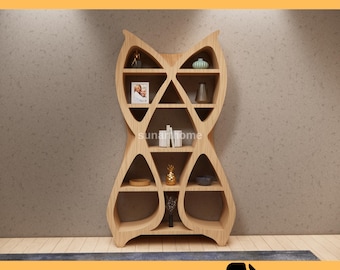 May include: A light-colored wooden bookshelf with an owl-like design. The CNC furniture file includes multiple shelves of varying sizes, holding decorative items. The top of the image reads "CNC FURNITURE FILE" and the bottom reads "CUTTING READY DXF FILE".