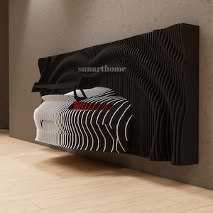May include: Black and white wall art featuring a stylized car design. The artwork has a layered, wave-like pattern, with red accents. The car is set against a black, textured background, mounted on a wall. The text "sunarthome" is visible.