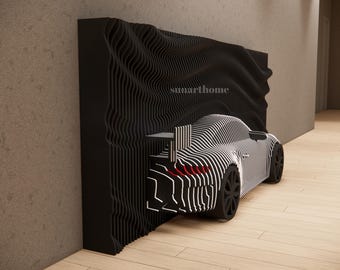 May include: A black and white striped car sculpture with a wavy black background. The car has black wheels and red taillights. The text "sunarthome" is visible on the background.