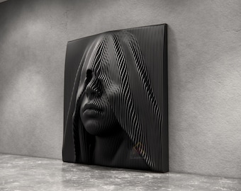 May include: A square black wall art piece featuring a three-dimensional relief of a human face partially obscured by a hood. The design is composed of numerous vertical, parallel slats that create a layered, wave-like texture across the surface.
