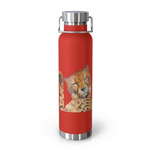 May include: Red stainless steel water bottle with a cheetah print design. The cheetah is depicted with its eyes closed, as if sleeping.