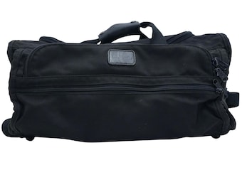 Bolsa de mão vintage TUMI preta dos anos 90