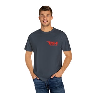 May include: A dark gray t-shirt with a red BSA Motorcycles logo on the front.